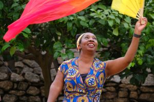 Wendy Shearer waving a colourful fan
