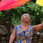 Wendy Shearer waving a colourful fan