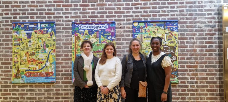 Tomorrowland Team infront of the maps