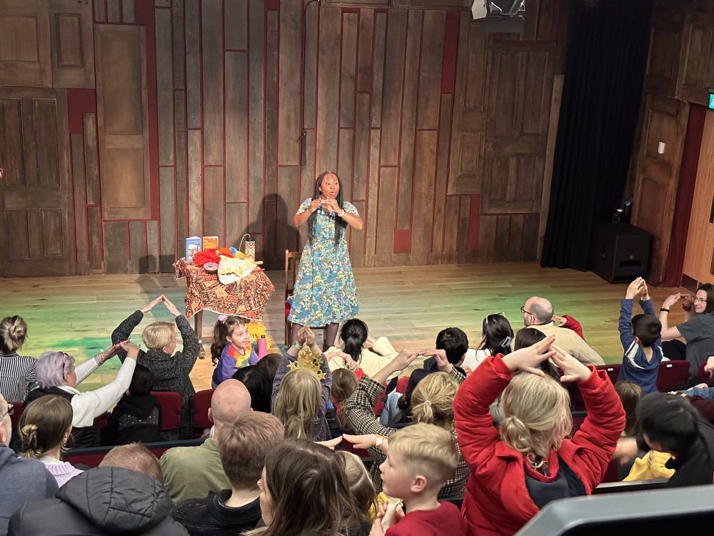 Wendy Shearer performing on stage at the Story Museum