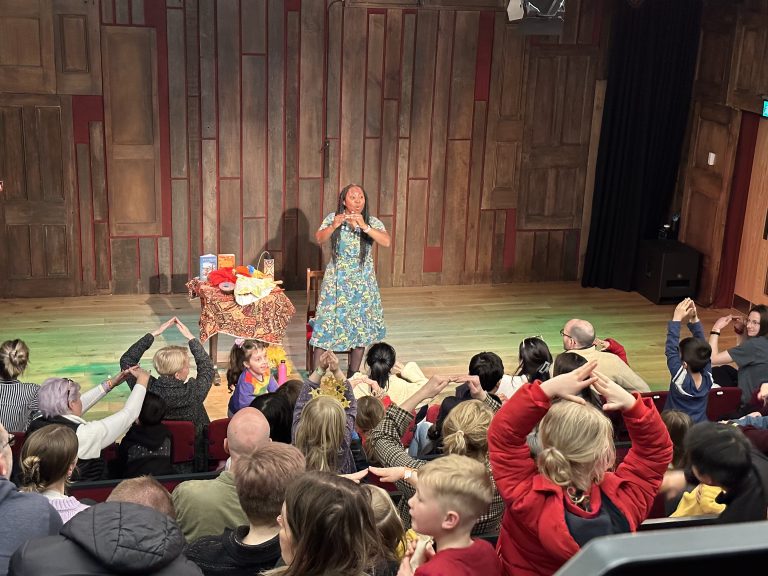 Wendy Shearer performing on stage at the Story Museum