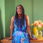 Wendy Shearer sitting with flowers