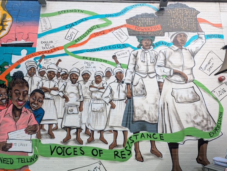 Mural of black coal workers at the Postal Museum