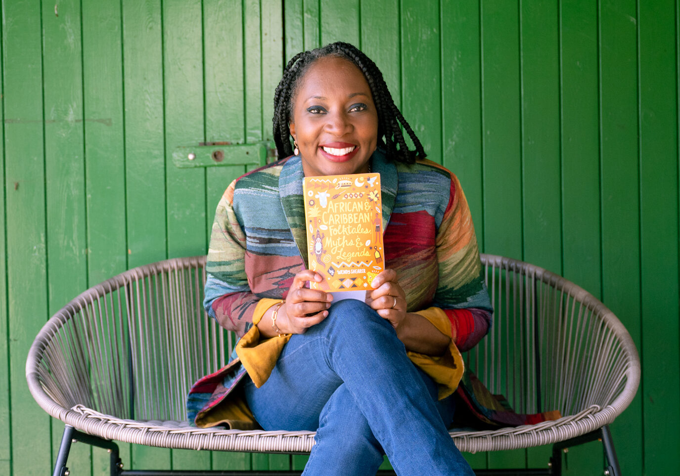Wendy Shearer holding a copy of her book