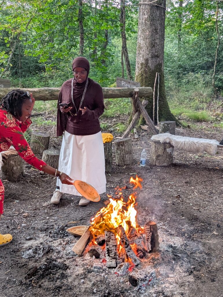 Attendees around the fire at the Black Design Guild Retreat
