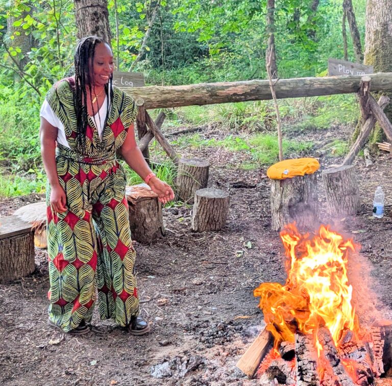 Wendy Shearer around the fire on 42 Acres